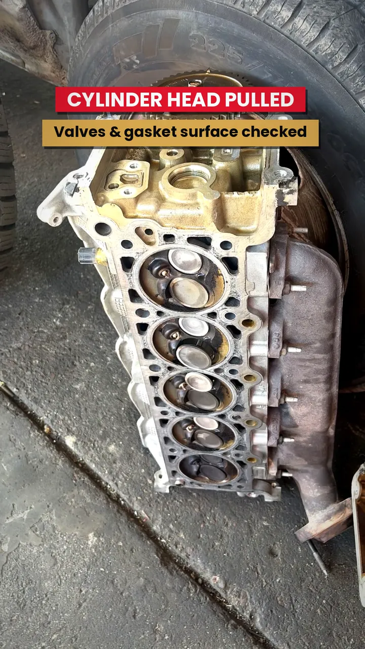 Cylinder head pulled off a 5-cylinder engine at C.C. Automotive Repair in Tucson